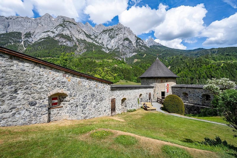 Tower on the castle wall, Hohenwerfen Fortress, rocky peaks of the Tennengebirge Mountains in the back, Werfen, Pongau, Salzburger Land, Austria