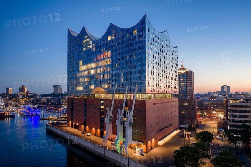 Aerial view of sunrise on the Elbe with Elbe Philharmonic Hall and reflections in the glass façade, Hamburg, Germany