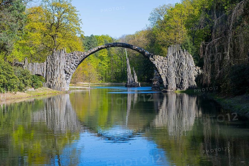 Stone bridge with perfect reflection in water surrounded by lush greenery, Rakotz Bridge, Devil's Bridge, Rakotzsee, arched bridge, reflection, basalt organ, Kromlau, Görlitz district, Saxony, Germany