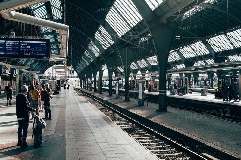 Historic track hall, station concourse of Karlsruhe Central Station with its distinctive, arched steel girders and glass roofs, Karlsruhe, Baden-Württemberg, Germany