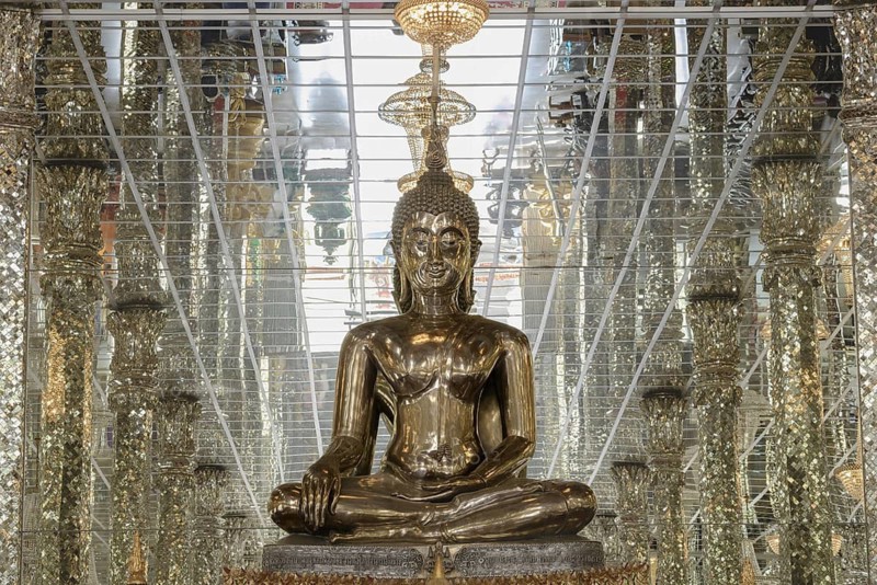 Silver Buddha statue, Bhumispara-mudra: Gautama Buddha at the moment of enlightenment, Wihan Kaeo (glass temple) : a breathtaking, mirrored ordination hall, Wat Muang, Ang Thong Province, Isan, Thailand