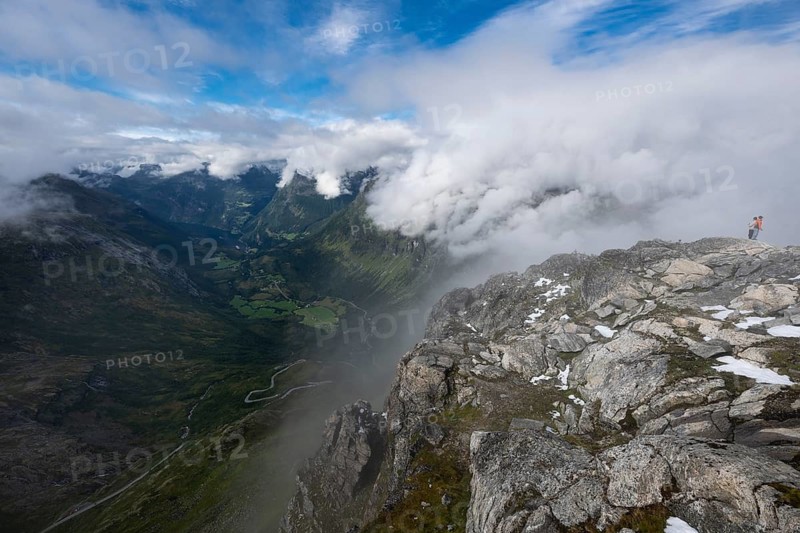 Famous curvy mountain road Fylkesvei 63 or Geirangervegen, which leads from Geiranger to the Djupvasshytta plateau, view of the Geiranger fjord from the 1476 meter high mountain peak and viewpoint Dalsnibba, Stranda, Møre og Romdal, Norway