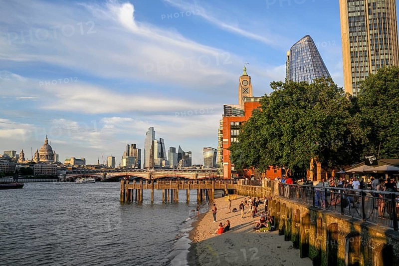 Sandy beach beach on the banks of the Thames near Gabriel's Wharf with views of Blackfriars Bridge and the City of London skyline with skyscrapers 22 Bishopsgate, Leadenhall Building, Cheesegrater, and 20 Fenchurch Street, Walkie Talkie, South Bank, London, England, Great Britain, Great Britain