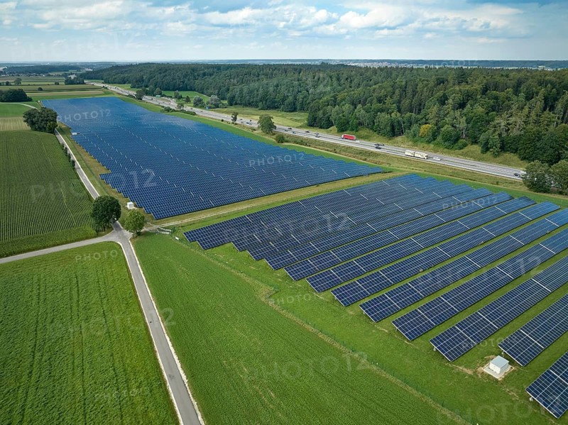 Aerial view of a huge photovoltaik power plant next to a highway in southern Germany, Altenstadt, Bavaria, Germany