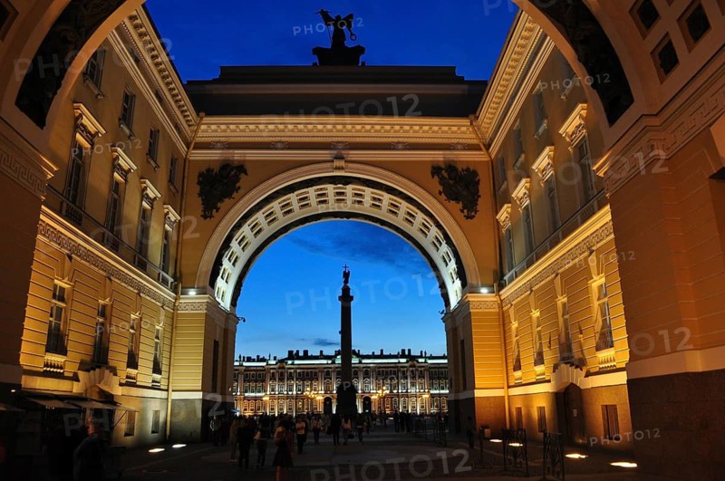 Impressive, illuminated archway with view of a colonnade at dusk, General Staff Building, Saint Petersburg, St. Petersburg, Russia