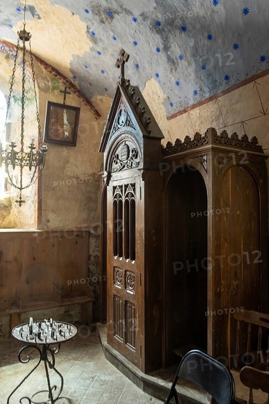 Wooden confessional booth in a church. Cantal. Auvergne Rhone Alpes. France