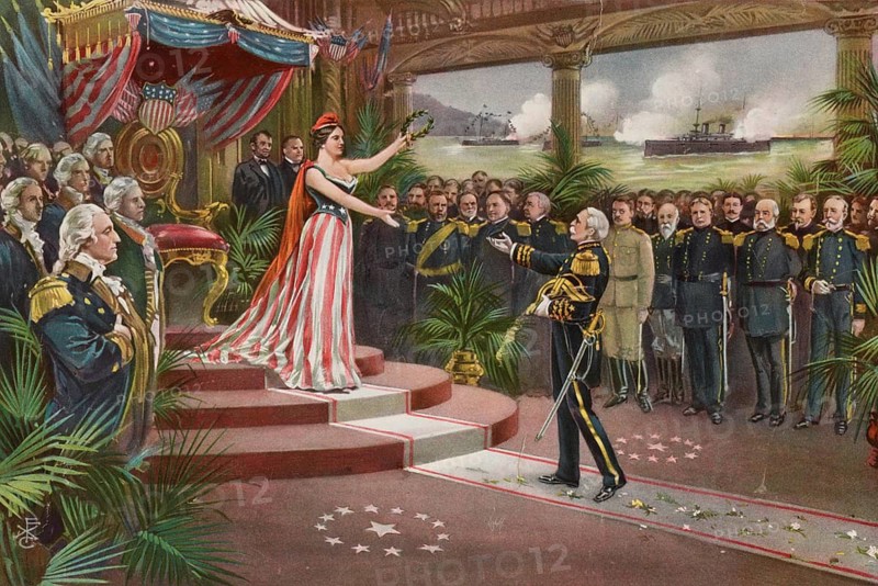 A patriotic illustration entitled *America's Welcome to Dewey* from 1899, depicting the reception given to Admiral George Dewey following victory in the Spanish-American War. A personification of the USA (Columbia) presents Admiral George Dewey with a laurel wreath in honour of his military achievements. The illustration features marines, officers and a naval battle scene alluding to the successful operation in Manila Bay, American history, an authentic, digitally restored reproduction of a 19th-century original, exact date of the depiction unknown, historical