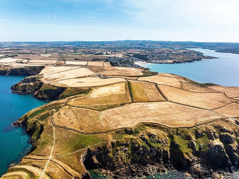 Seven Souls Rock and Pentire Point and Bay over Padstow Bay from a drone, Polzeath, Cornwall, England, Summer 2026