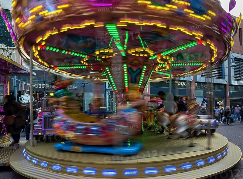 Rotating children's carousel in motion, Enschede, the Netherlands