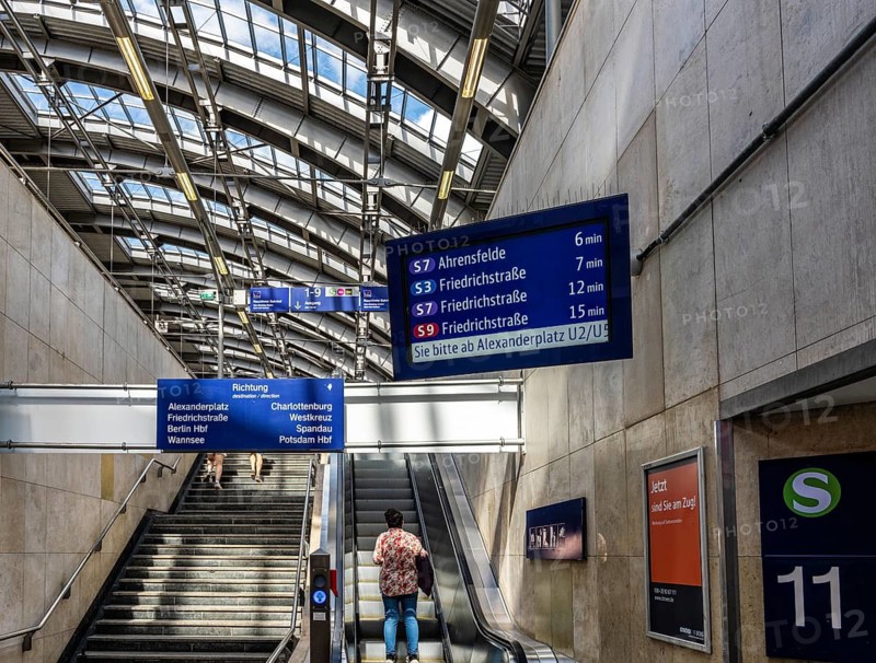 Blue information displays on the escalators leading to the platform at Berlin's Ostbahnhof, Berlin, Germany