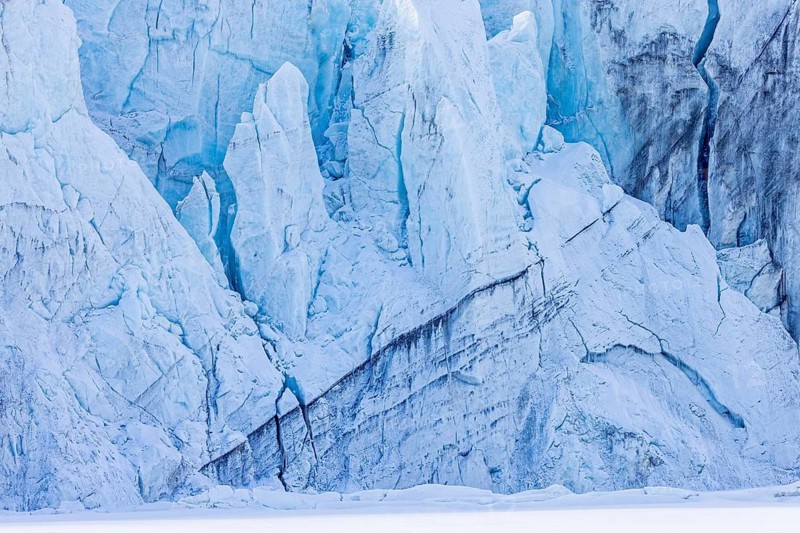 View over Ulvebreen, glacier in Sabine Land debouching into the bay of Dunérbukta on western shore of Storfjorden in spring, Spitsbergen, Svalbard