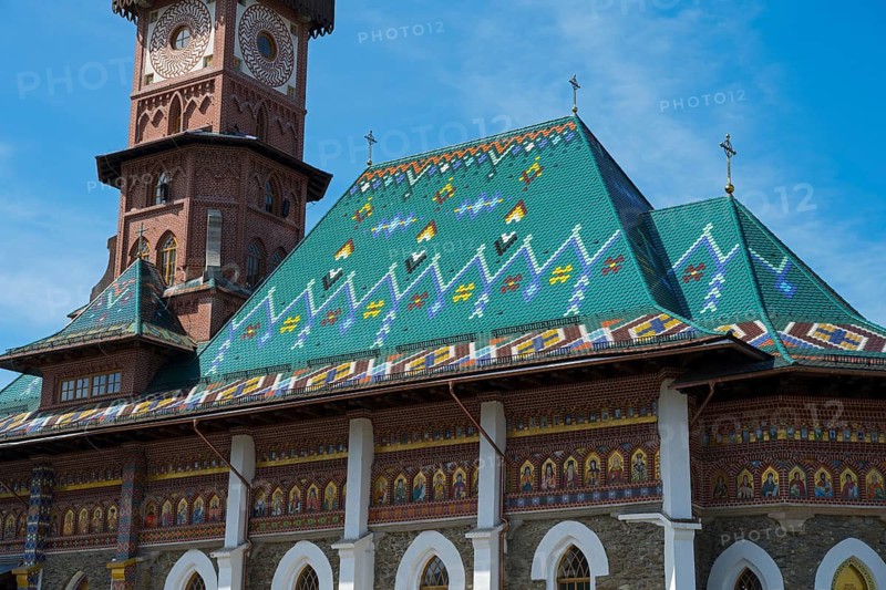 Detailed view of an ornamental Gothic church roof landscape with brick tower, Church of the Nativity of the Blessed Virgin Mary, Happy Cemetery, Cimitirul Vesel, Sapân?a, Sapanta, Maramure?, Maramures, Maramuresch, Romania