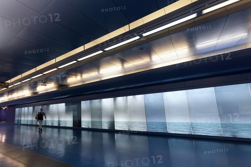 Passage in Toledo metro station, backlit wall with photo of the sea, architect Oscar Tusquets Blanca, art subway, Metrò dell' Arte, Naples, Campania, Italy