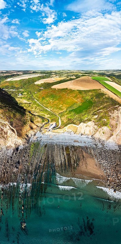 Cliffs and Farms over North Devon and Cornwall Coastpath Border from a drone, Welcombe Mouth Beach, Devon, Cornwall, England, Summer 2026
