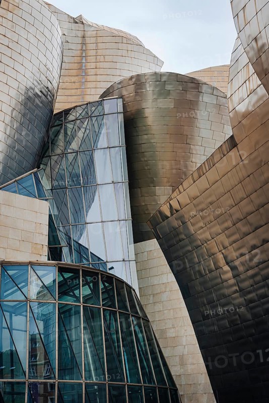Exterior view of the Guggenheim Museum with titanium plates and glass elements in Bilbao, Spain