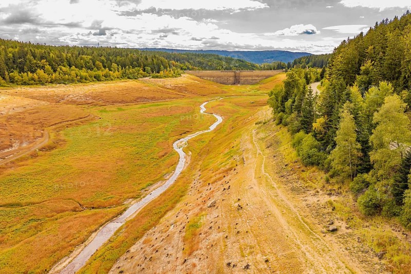 Panoramic view of a river between autumnal hills and dense forests, rehabilitation of the Schwarzenbach dam, Forbach, Black Forest, Germany