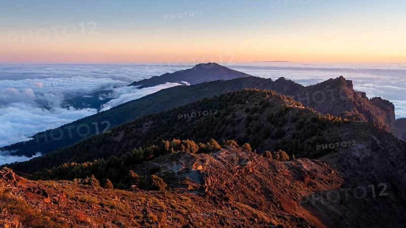 View of the south of the island on the way to Pico de La Nieve. Sea of fog in the valley at sunset. La Palma, Canary Islands, Spain