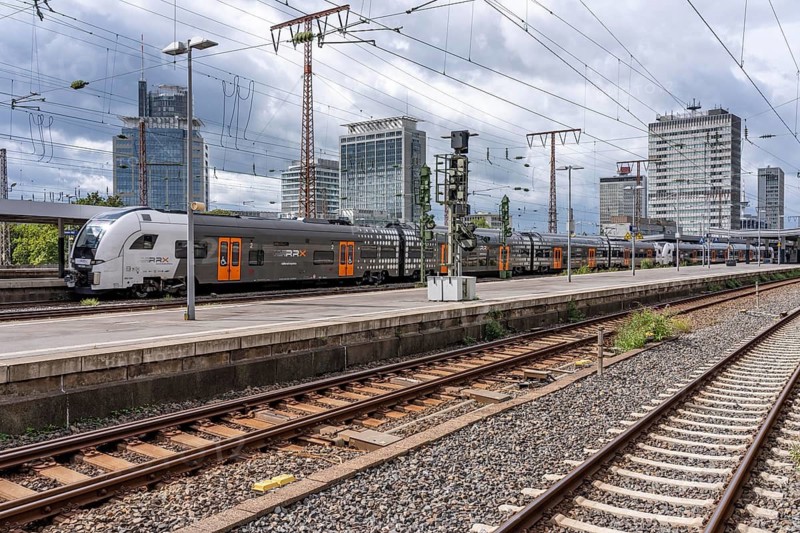 RRX, Rhein-Ruhr-Express, regional express, in Essen main station, city skyline, high-rise office buildings, North Rhine-Westphalia, Germany