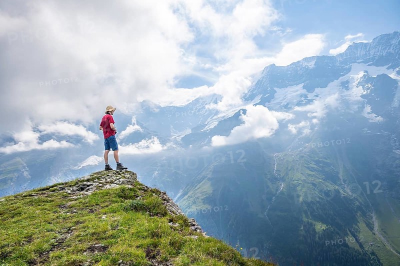 Mountaineers in front of picturesque mountain scenery at the summit of Tanzbödeli, Bernese Alps, Bernese Oberland, Switzerland