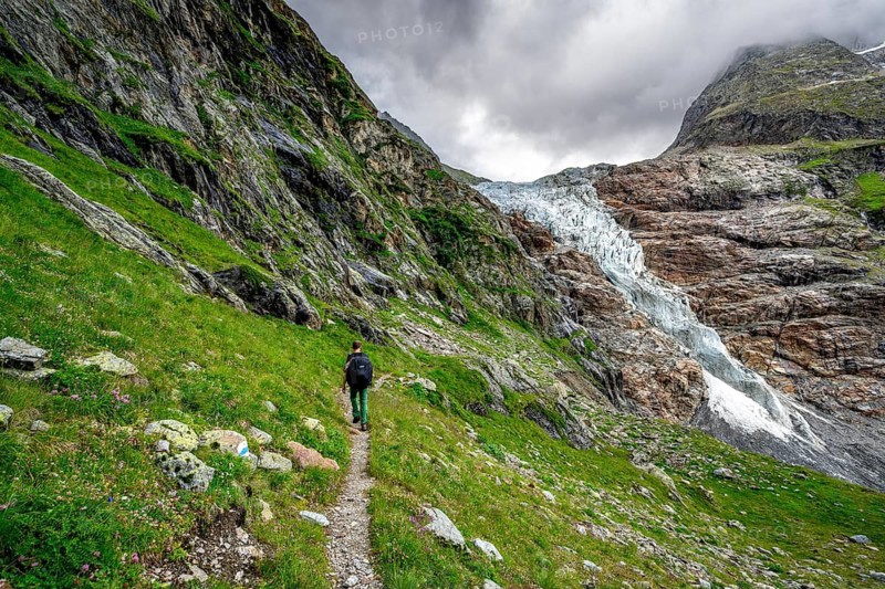Mountaineers on a hiking trail, dramatic mountain landscape with Lower Arctic Sea glacier, Bernese Alps, Bernese Oberland, Switzerland