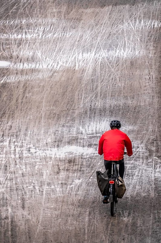 Dirt road, with many tracks of two-wheelers, footprints, wet, after rain, parallel, mixed up