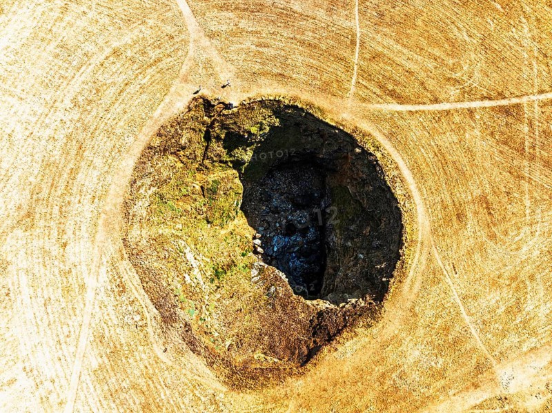 Top Down View of Trevone Round Hole over Trevone Bay from a drone, Trevone, Padstow, Cornwall, England, United Kingdom, Summer 2026