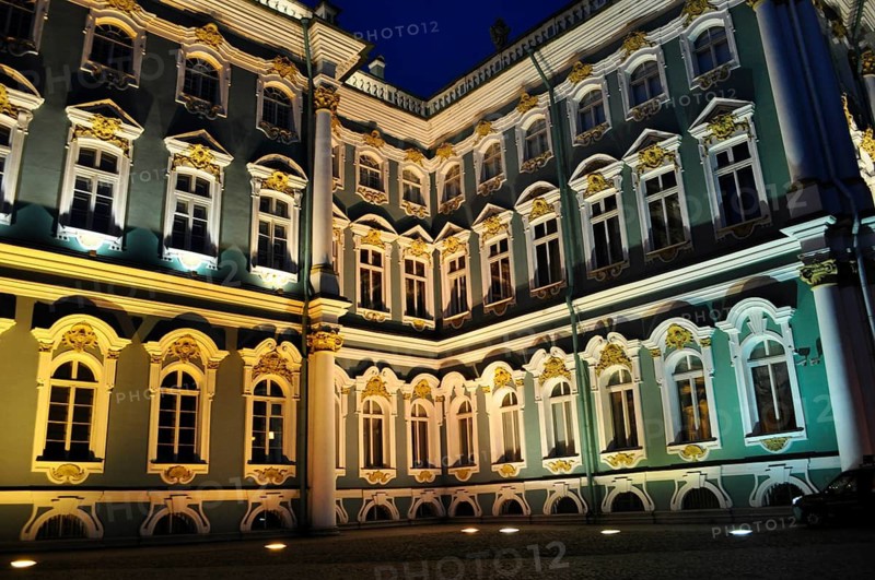 A corner of the palace at night, artfully illuminated, shows numerous windows, Winter Palace, Hermitage, Saint Petersburg, St. Petersburg, Russia
