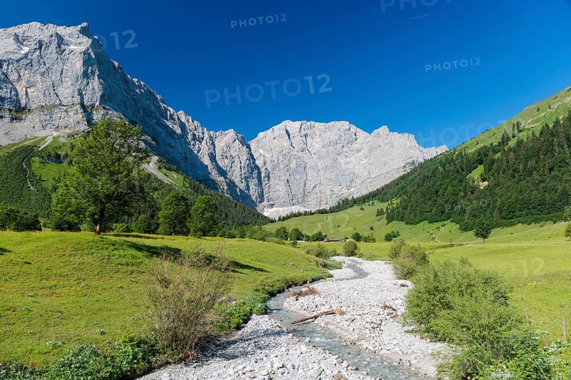 Enger Grund Creek in the Grosser Ahornboden Nature conservancy area on a sunny day. Eng valley, Tyrol, Karwendel mountains, Austria