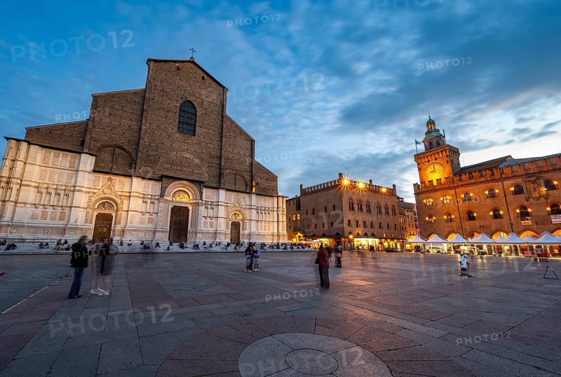 Illuminated Piazza Maggiore with Basilica di San Petronio and Torre dell'Orologio, blue hour, old town, Bologna, Emilia Romagna, Italy