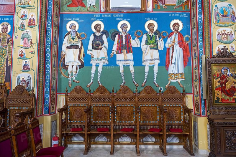 Detail of a wall painting depicting saints in traditional clothing, including handmade wooden chairs, interior of the Church of the Nativity of the Blessed Virgin Mary, Happy Cemetery, Cimitirul Vesel, Sapân?a, Sapanta, Maramure?, Maramures, Maramuresh, Romania