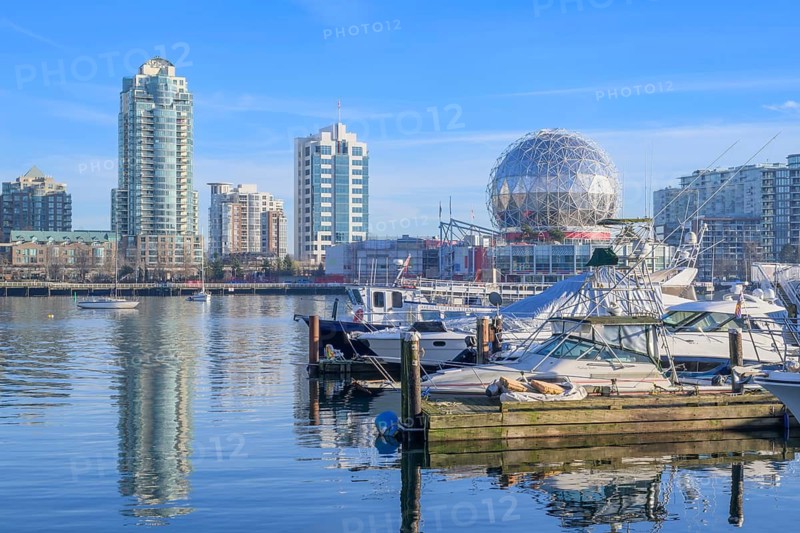 Science World and downtown apartment towers viewed from a marina on False Creek, Vancouver, British Columbia, Canada