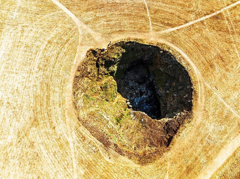 Top Down View of Trevone Round Hole over Trevone Bay from a drone, Trevone, Padstow, Cornwall, England, United Kingdom, Summer 2026