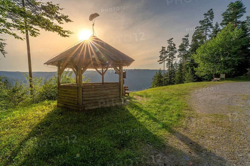 A pavilion facing the light of the setting sun, surrounded by forests, Simmelhütte, Bad Wildbad. germany