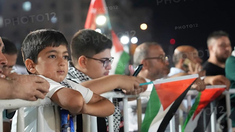 Gaziantep, Turkey - August 06, 2026: Participants of the Palestine Convoy, which set off from Sarajevo, Bosnia and Herzegovina, gather alongside local residents in Gaziantep while waving Palestinian flags to draw global attention to ongoing Israeli attacks on Gaza and the humanitarian crisis in Palestine, Gaziantep, Turkey