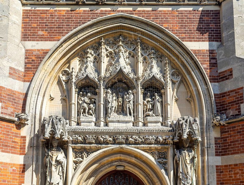 Intricate stone portal relief west entrance of Roman Catholic church of Saint Edmund, Bungay, Suffolk, England, UK completed 1901