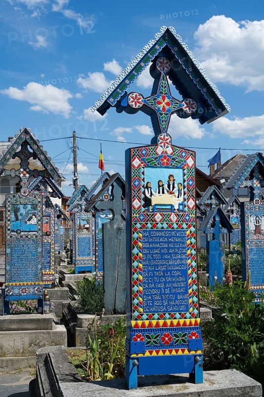 Colourful tomb with traditional patterns and ornate decorations, traditional wooden grave sites, Happy Cemetery, Cimitirul Vesel, Sapân?a, Sapanta, Maramure?, Maramures, Maramures, Romania