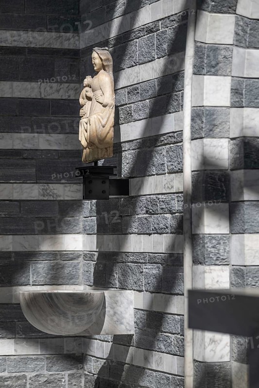 Virgin and Child sculpture over baptismal font, interior, Roman Catholic church of San Giovanni Battista, built in the same place as the village church destroyed by avalanche in 1986, architect Mario Botta, Mogno, Maggia Valley, Valle Maggia, municipality of Lavizzara, Canton of Tessin, Switzerland