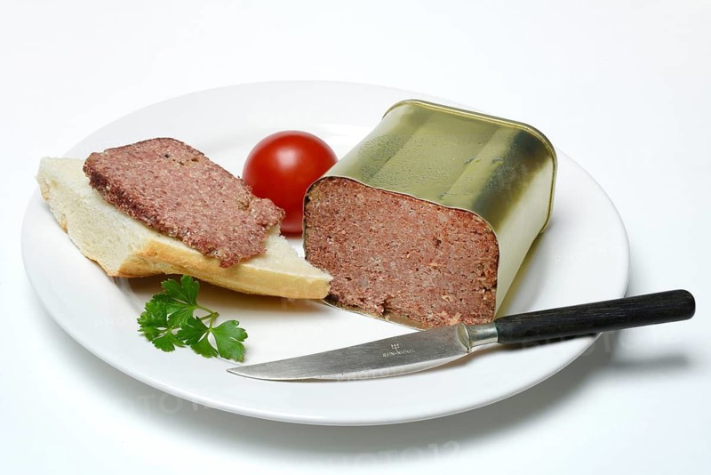 Canned corned beef, beef on plate with knife