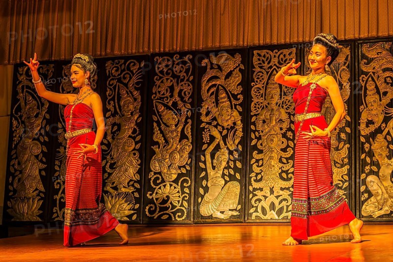 Young Thai women in traditional dress showing a traditional dance, Old Chiang Mai Cultural Center, Chiang Mai, Thailand