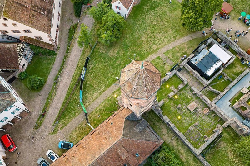 Historic tower with adjacent buildings and cars from a bird's eye view, Calwer Klostersommer Festival, Hirsau Abbey, Calw, Black Forest, Germany