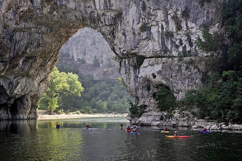 Canoes on the Ardèche river, above the Pont d'Arc rock gate, Ardèche Gorge, Gorges de l'Ardèche, Vallon-Pont-d'Arc, Rhône-Alpes, France