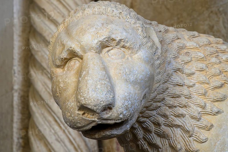 Lion statue at the West Portal of the Cathedral of St. Lawrence, Trogir, Croatia. The sculpture was signed and dated in 1240 by the master sculptor Radovan