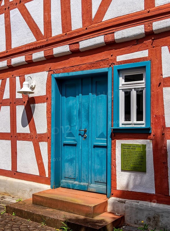 Entrance to the former school and local history museum with teachers' apartment in the back part of the building, Dreieichenhain, Hesse, Germany