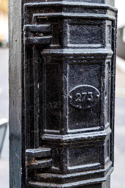 Secret London, Detail of the numbered lamp post door once used by Soviet agents as a Cold War dead letter box on the Audley Square KGB spy lamp post in London, England, United Kingdom
