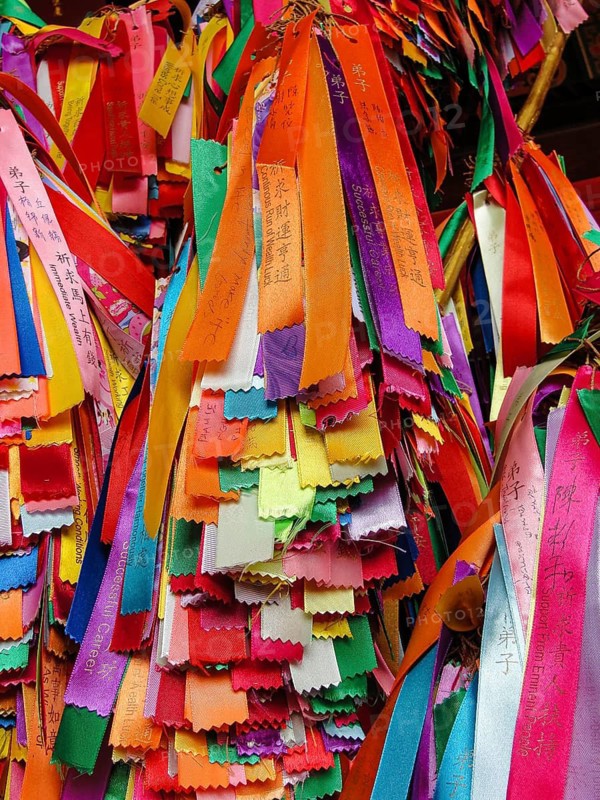 Many colorful ribbons with wishes hangs in the temple. Georgetown, Penang, Malaysia, colorful background, Vibrant colorful ribbons with messages stacked together, creating a textured and festive appearance, George Town, Penang, Malaysia