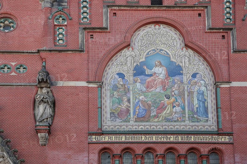 Wall mosaic with Jesus at the Sermon on the Mount and Bible quote, Whoever comes with, I will not push out, John 6, 17, inscription, handicrafts, Gothic Brethren Church, red brick church, Altenburg, Thuringia, Germany