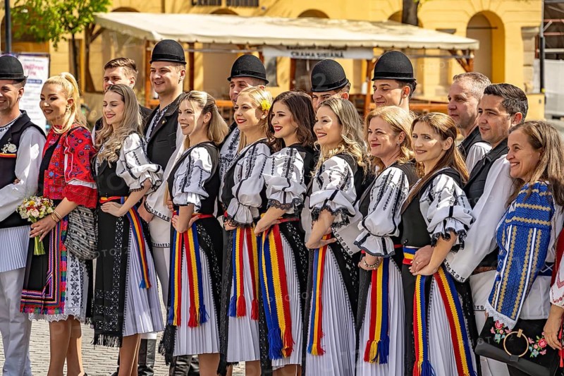 Wedding party in traditional dress on Little Ring Square or Pia?a Mica in the old town of Sibiu or Sibiu, Transylvania, Romania