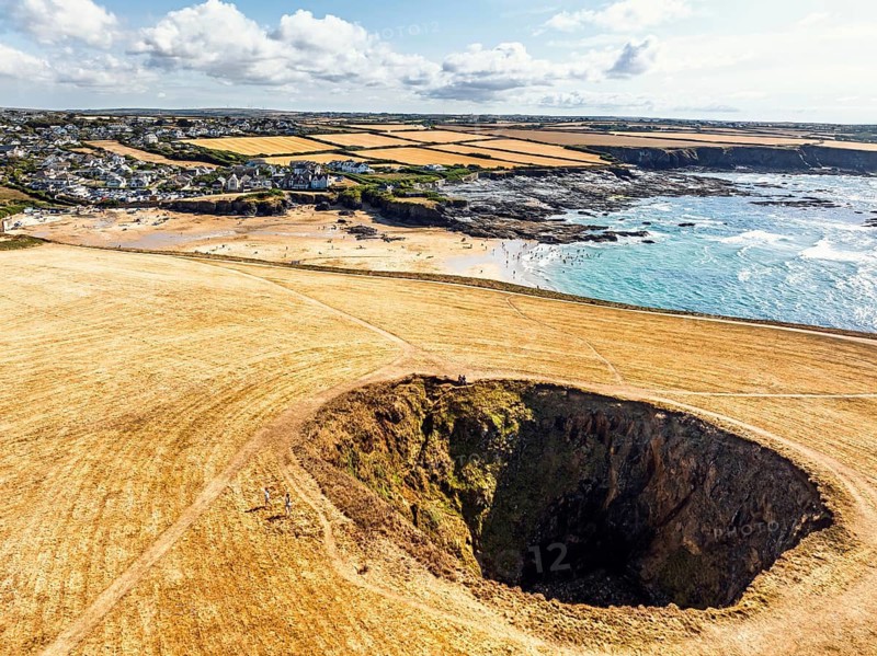 Top Down View of Trevone Round Hole over Trevone Bay from a drone, Trevone, Padstow, Cornwall, England, United Kingdom, Summer 2026