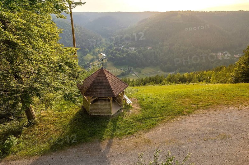 A pavilion with a view of a picturesque valley, surrounded by forests in the evening light, Simmelhütte, Bad Wildbad. germany