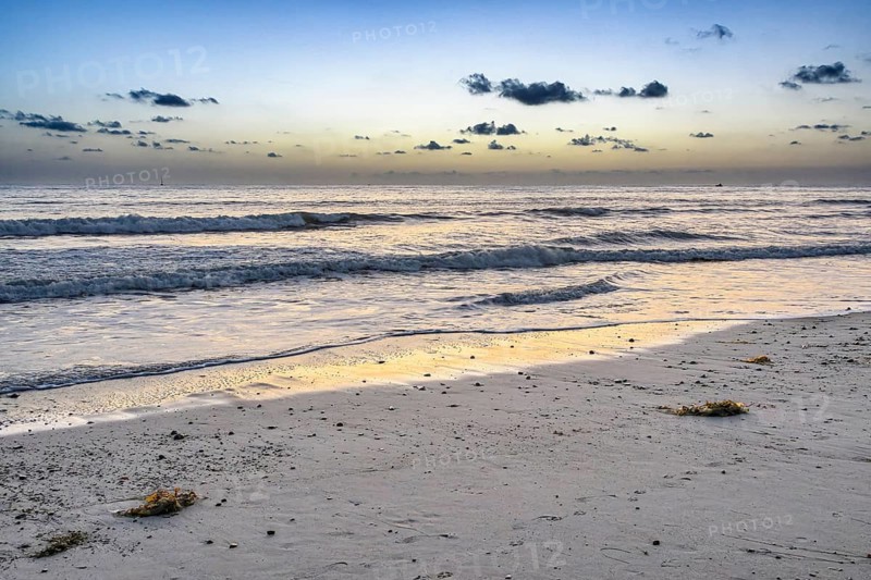 Waves roll in at sunset on Poche Beach, San Clemente, California, United States